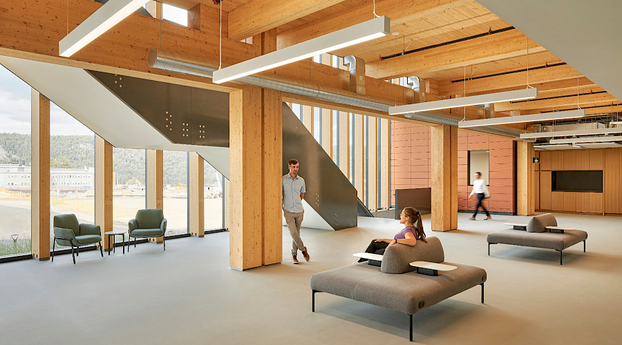 Gathering space at the Science Collaboration Centre built by Chandos Construction Ottawa with earth tones and visible mass timber