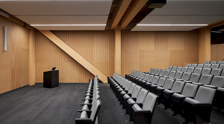 Science collaboration center auditorium with mass timber features built by Chandos Construction