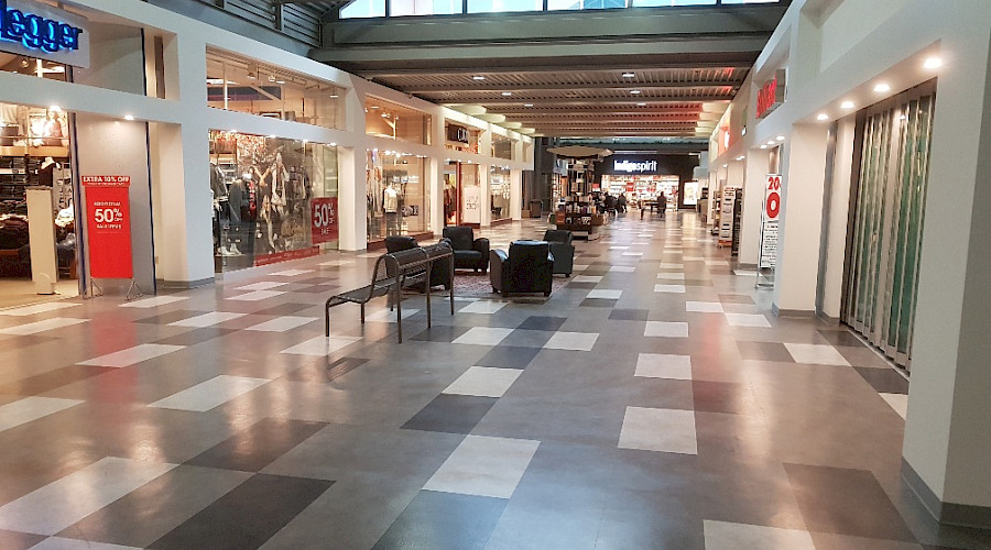 Interior shot of the Westland Market Mall new flooring and new drywall storefronts installed and built by Chandos Construction Edmonton