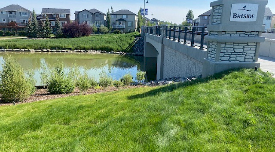 Image of the completed canal bridge with water running underneath, built by Chandos Construction Civil team.