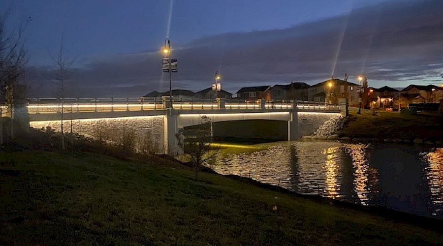 Image of the completed canal bridge with water running underneath, built by Chandos Construction Civil team.