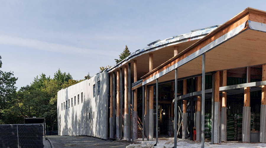 Exterior shot of construction happening at the National Centre for Indigenous Law, completed by Chandos Construction Vancouver. Showcasing the mass timber structure