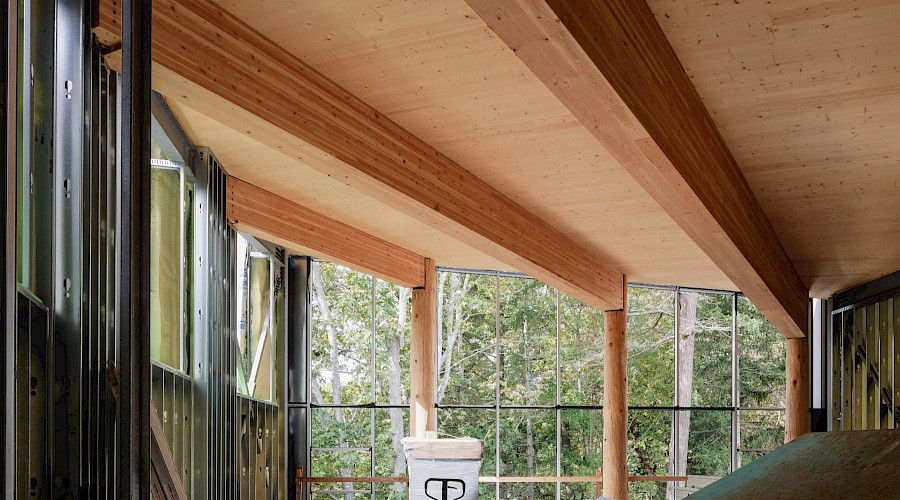 Interior shot of construction happening at the National Centre for Indigenous Law, completed by Chandos Construction Vancouver. Showcasing the mass timber structure