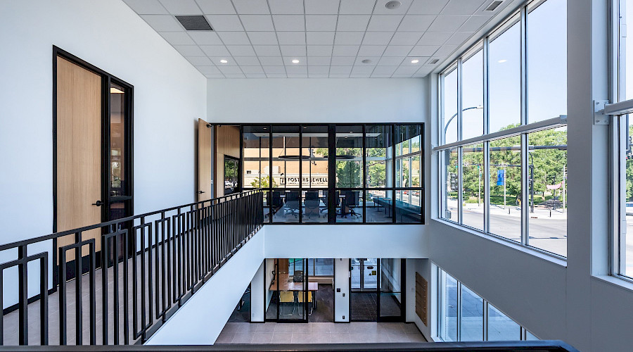 Interior image of the second floor veranda looking down to the Canadian Western Bank lobby in Lethbridge. Alberta. Built by Chandos Construction Calgary